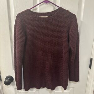 Two women’s sweaters